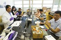 Chinese visitors in lab