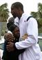 One of car winners hugs NBA star